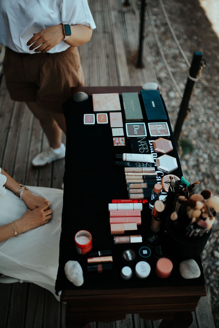 gallery-06 Top view of various makeup products on a table outdoors in Muğla, Türkiye.
