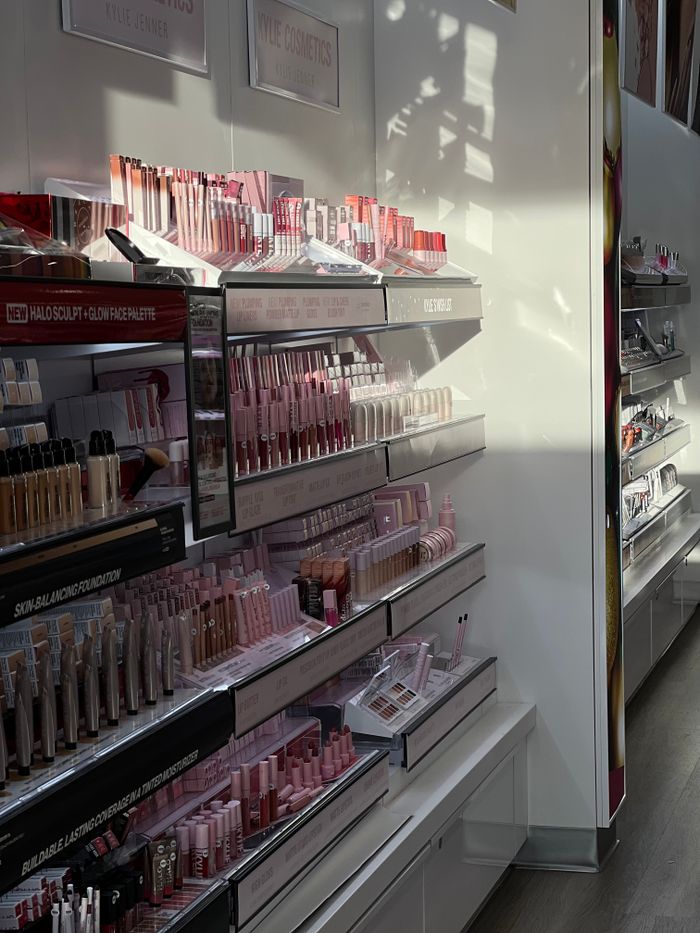Crafting Captivating Headlines: Your awesome post title goes here Brightly lit cosmetics aisle featuring a variety of makeup products neatly arranged on shelves.